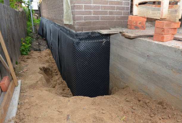 Happy homeowners after waterproofing job in Ellettsville